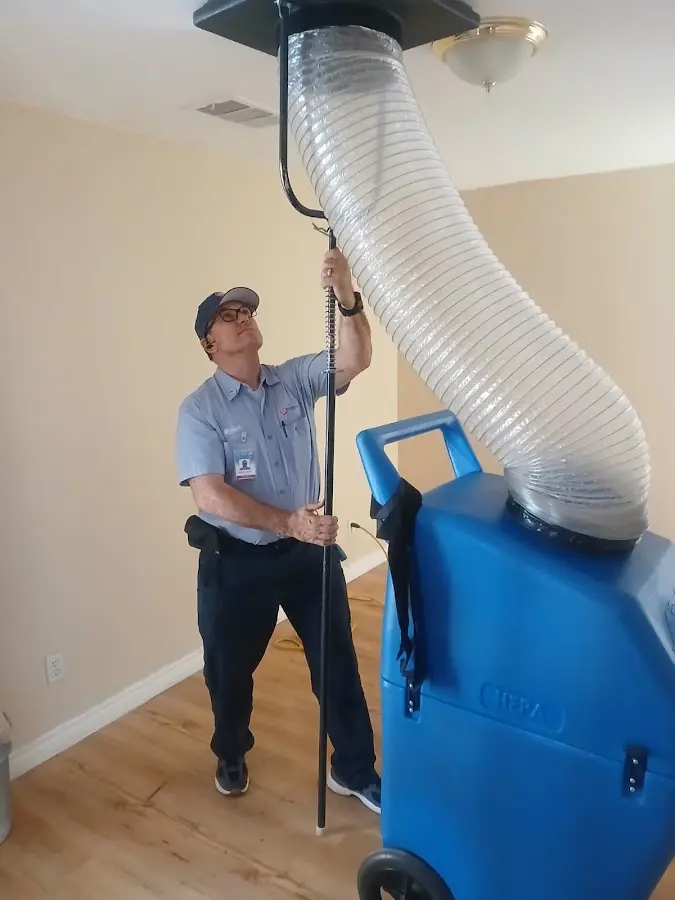 Furnace Tune-Up technician using HEPA equipment in White Oak